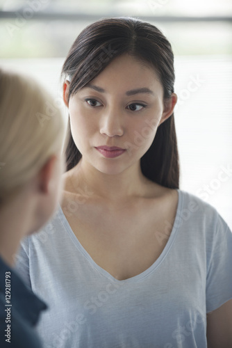 Wallpaper Mural Woman having conversation with friend Torontodigital.ca