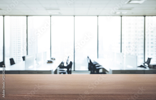 Empty wood table with blur room office and window city view background