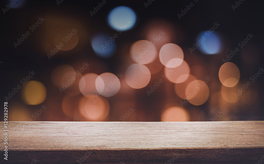 Empty of wood table top with blurred light gold bokeh background