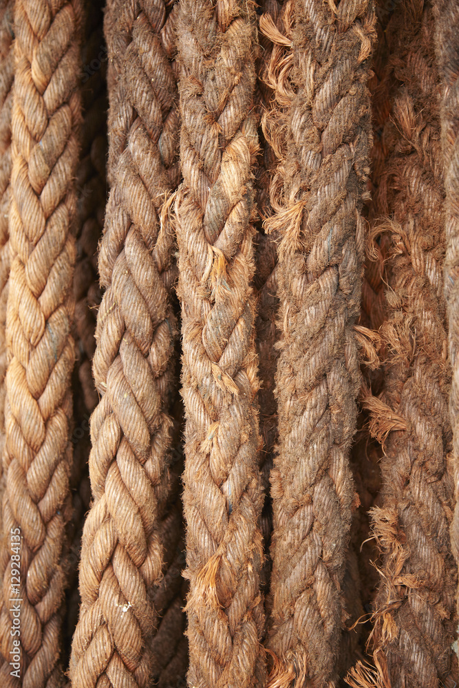 A full page of faded orange fishing rope background texture A full page of faded orange fishing rope background texture