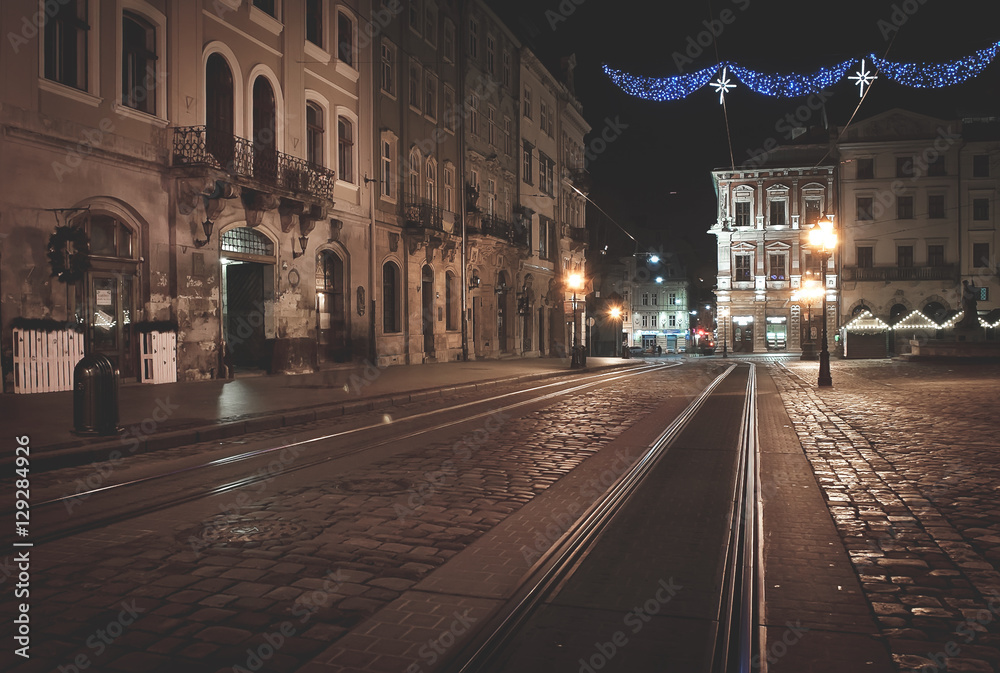 Old European city with christmas decoration and light at night