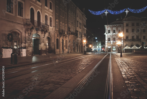 Old European city with christmas decoration and light at night