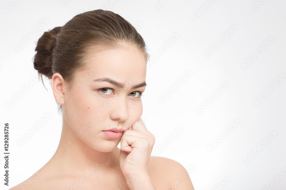 sad beautiful girl looking at camera on white background with copyspace sad beautiful girl looking at camera on white background with copyspace