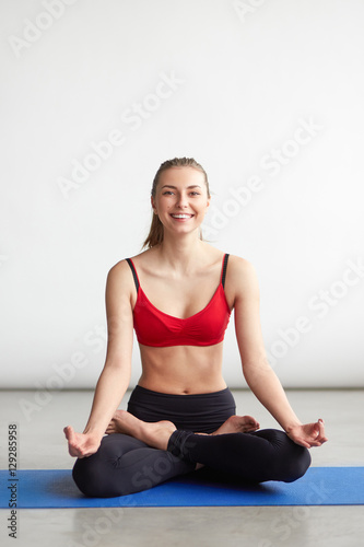 Fototapeta Naklejka Na Ścianę i Meble -  beautiful young woman doing yoga exercise