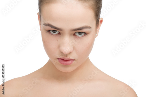 angry beautiful girl looking at camera on isolated white background
