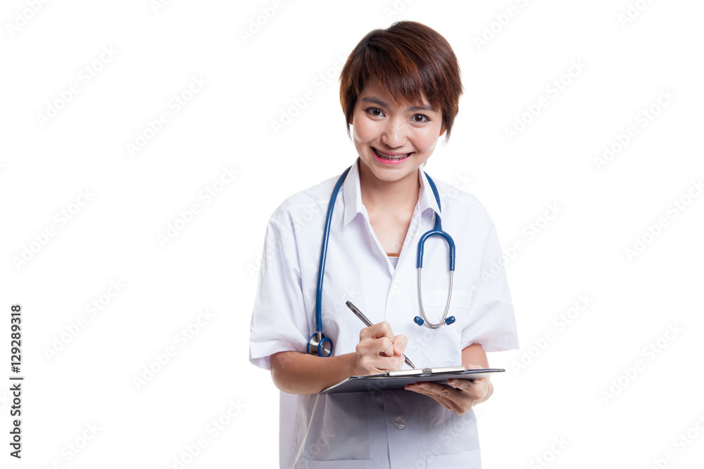 Asian young female doctor write on a clipboard. Asian young female doctor write on a clipboard.