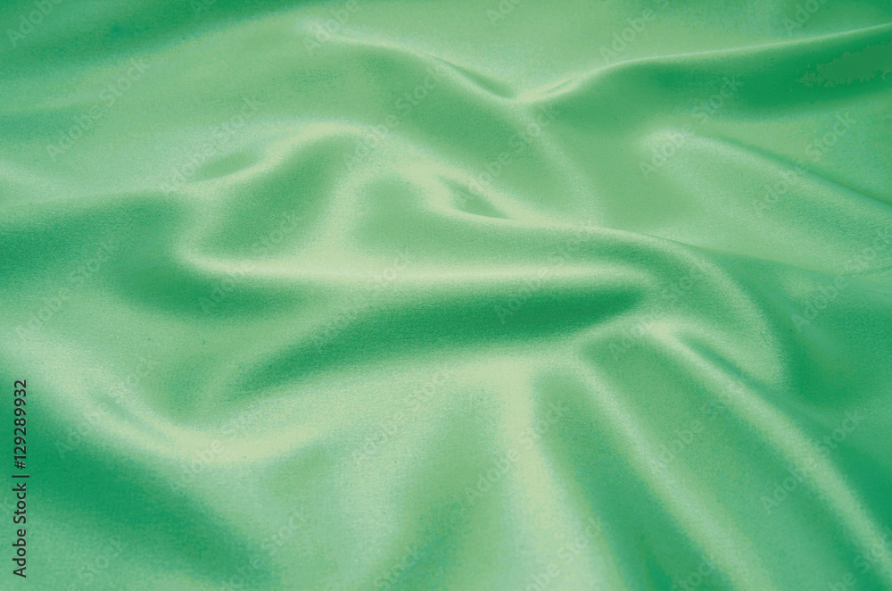 Obraz premium green satin fabric as background