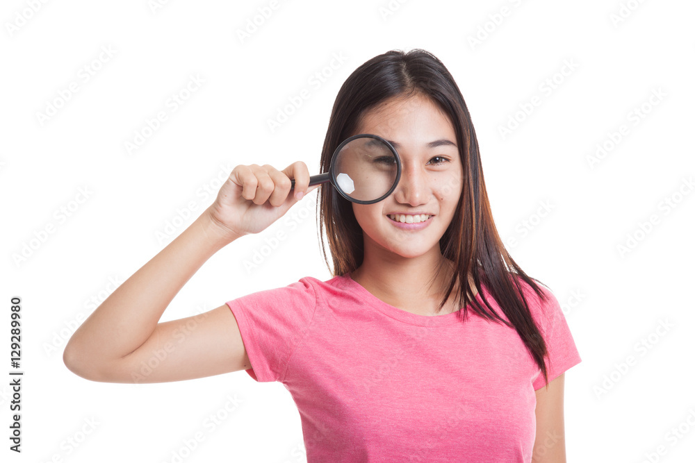 Young Asian woman with a magnifying glass Young Asian woman with a magnifying glass