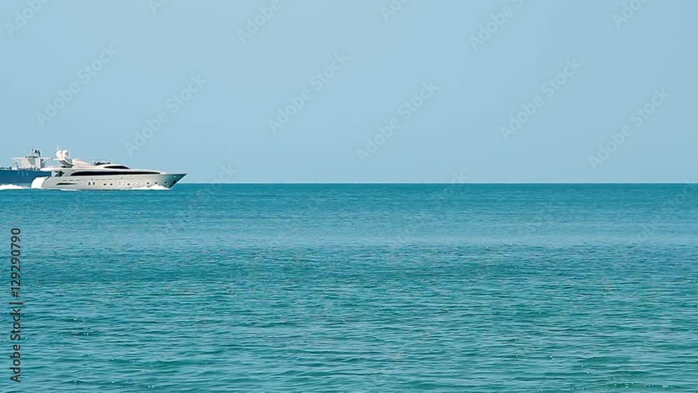 Luxury white speed yacht in open waters Luxury white speed yacht in open waters