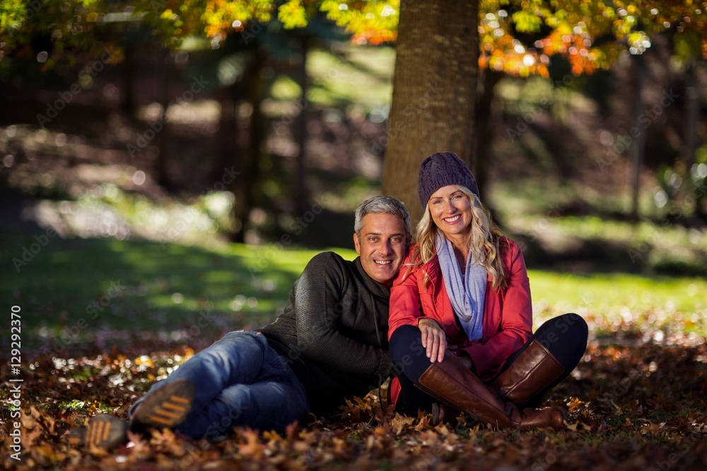 Fototapeta premium Side view of couple hugging at park