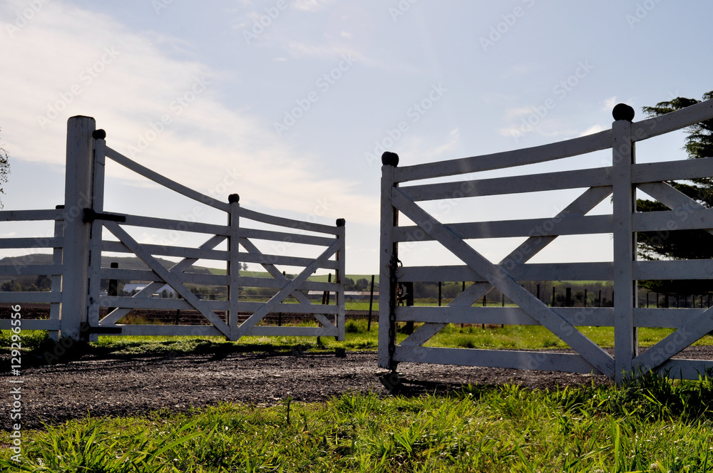 Farm entrance gate landscape background. Farm entrance gate landscape background.