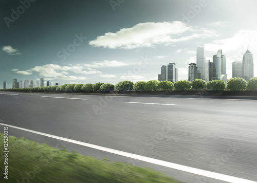 Motion blur cityscape and skyline in cloud sky on view from empt