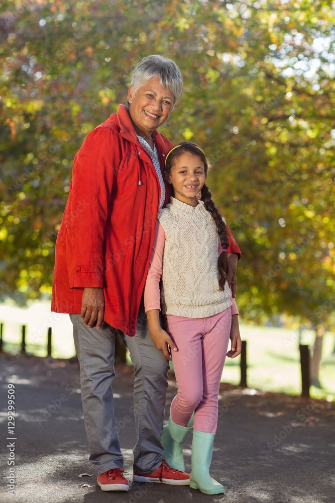 Happy granddaughter with grandmother at park Happy granddaughter with grandmother at park