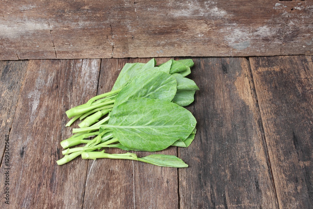 Chinese kale fresh vegetable on wooden table background Chinese kale fresh vegetable on wooden table background