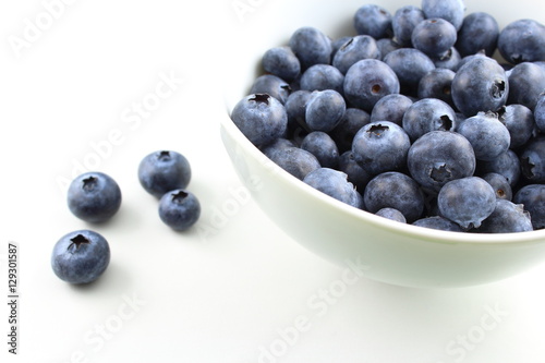 blueberry fruits in a small white bowl