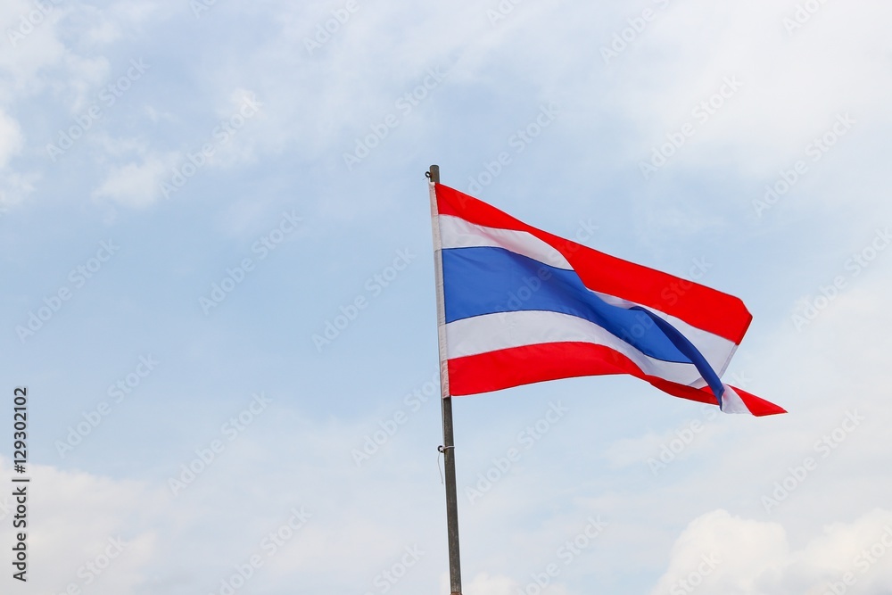 Thai flag, waving in the wind with beautiful with blue sky background