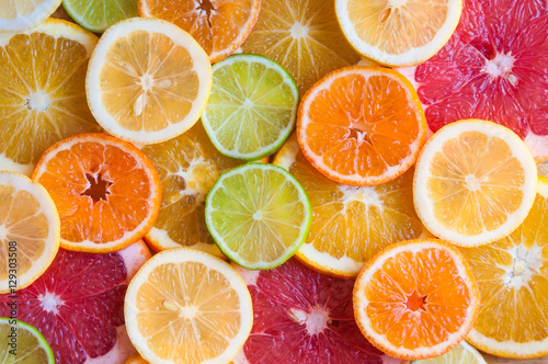 Slices of various citrus fruits (orange, grapeftuit, lemon, mandarine, lime)