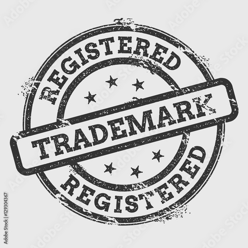 Registered trademark rubber stamp isolated on white background. Grunge round seal with text, ink texture and splatter and blots, vector illustration.