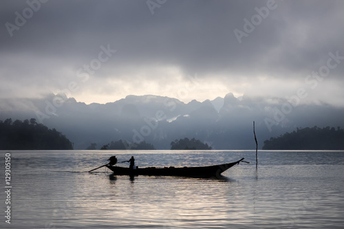 Boat in lake with mount and cloud