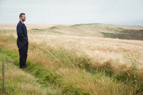 Thoughtful farmer standing in field © WavebreakmediaMicro