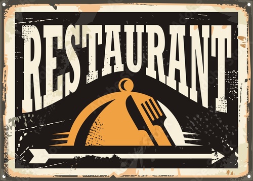 Restaurant vintage tin sign on old black background