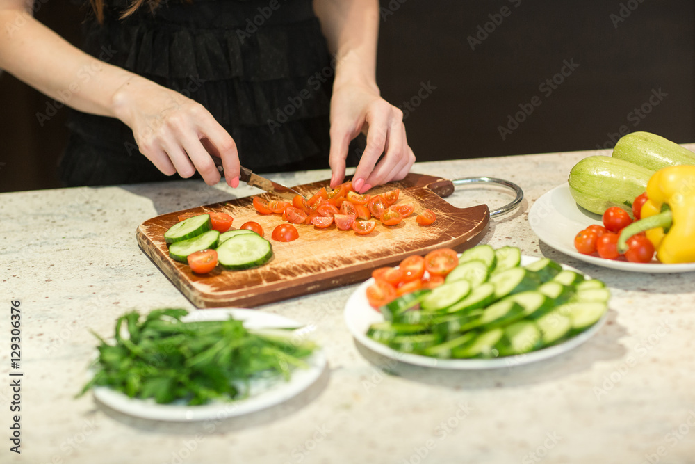 Woman's hands cutting vegetables. Woman's hands cutting vegetables.