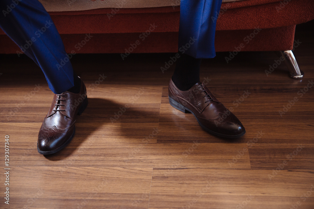 Business man dressing up with classic, elegant shoes. Groom wearing on wedding day, tying the laces and preparing. Business man dressing up with classic, elegant shoes. Groom wearing on wedding day, tying the laces and preparing.
