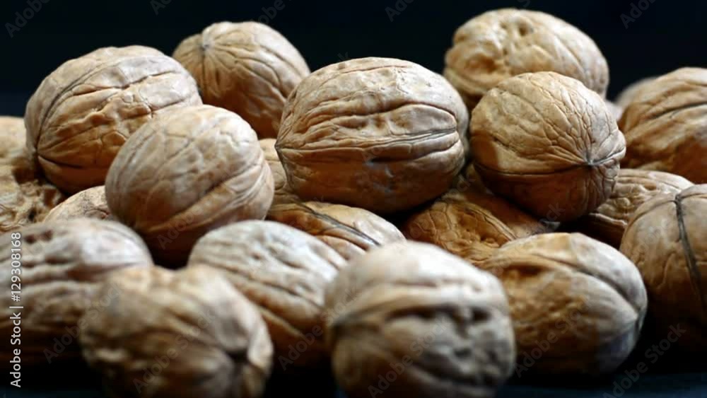 Fresh walnuts in shells, slow pan right. Fresh walnuts in shells, slow pan right.