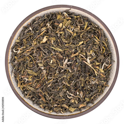 Bilde på lerret Organic green tea darjeeling in ceramic bowl isolated on white background, top v