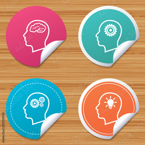 Round stickers or website banners. Head with brain and idea lamp bulb icons. Male human think symbols. Cogwheel gears signs. Circle badges with bended corner. Vector