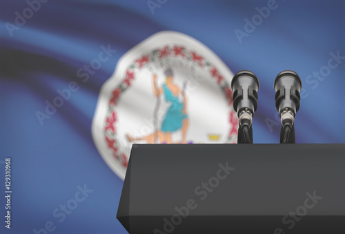 Pulpit and two microphones with USA state flag on background - Virginia