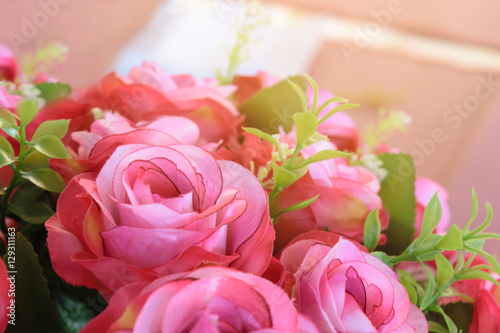 a pink rose bouquet with sun rays in a special day. valentine or wedding day.