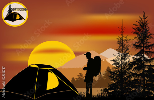 hiker near tent in forest at sunset