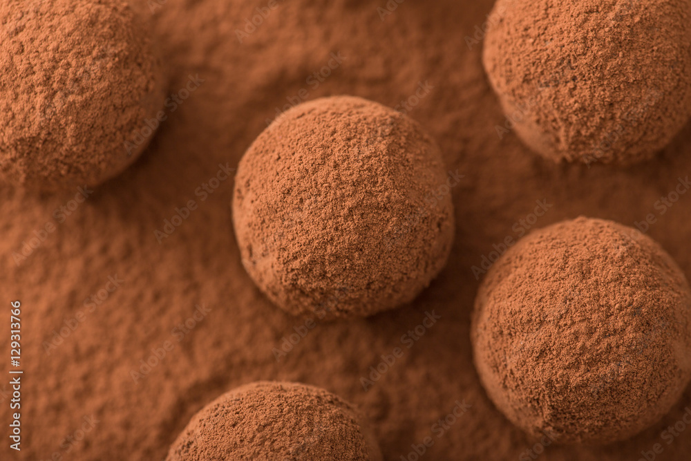 Close up of group of appetizing black chocolate truffles covered Close up of group of appetizing black chocolate truffles covered