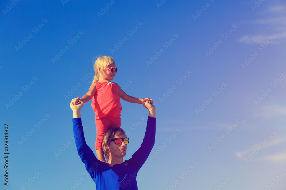 Father and little daughter play at sky Father and little daughter play at sky