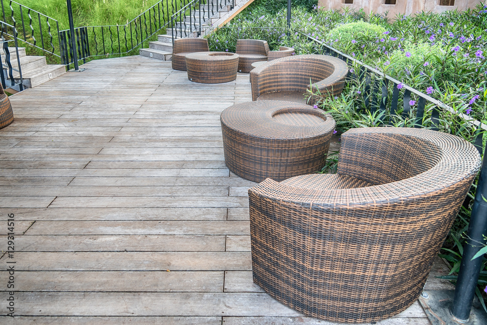 The wood table on natural outdoor of a restaurant with tree and The wood table on natural outdoor of a restaurant with tree and