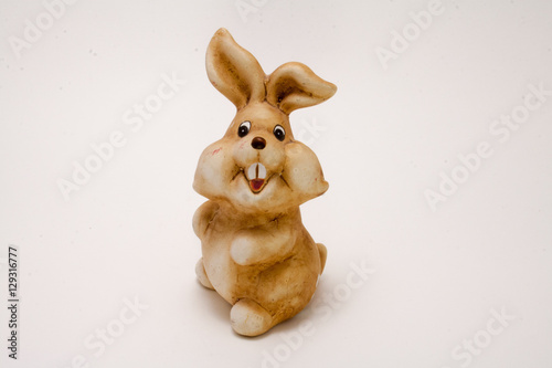 ceramic figurine brown rabbit isolated on white background
