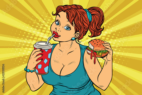 Young woman drinking Cola and eating Burger