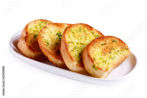Garlic bread in a plate on white background