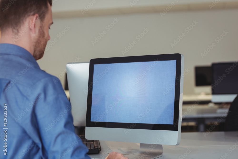 Mature student using computer Mature student using computer