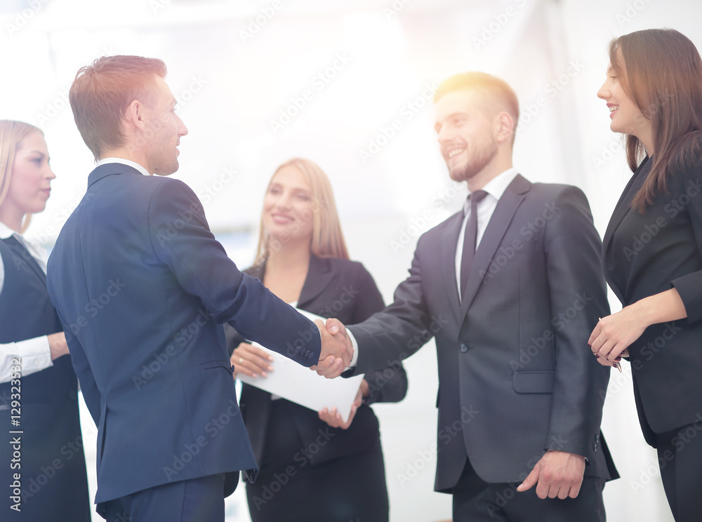 Handshake to seal a deal after a job recruitment meeting in a of Handshake to seal a deal after a job recruitment meeting in a of