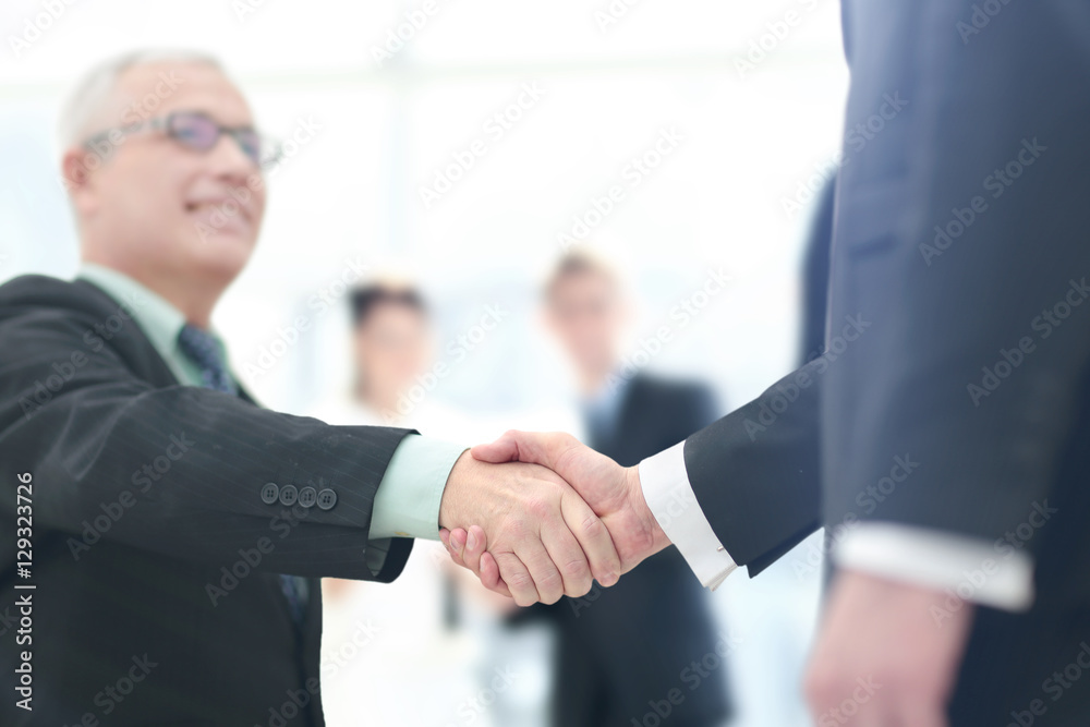 Concept of partnership - handshake business partners Concept of partnership - handshake business partners