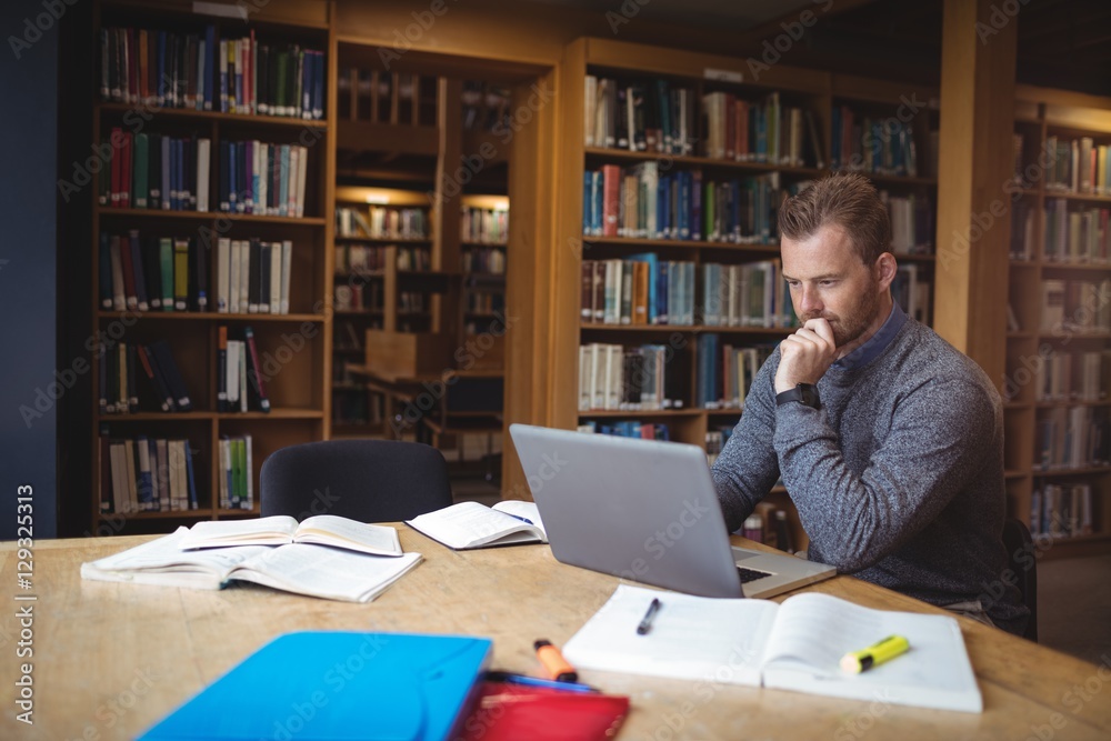 Mature student using laptop Mature student using laptop