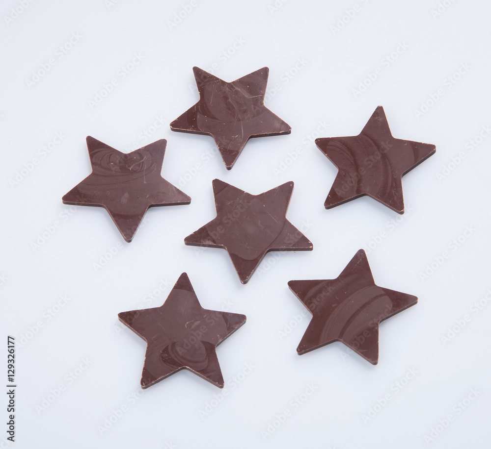 Obraz premium Chocolate or chocolate star on a background.