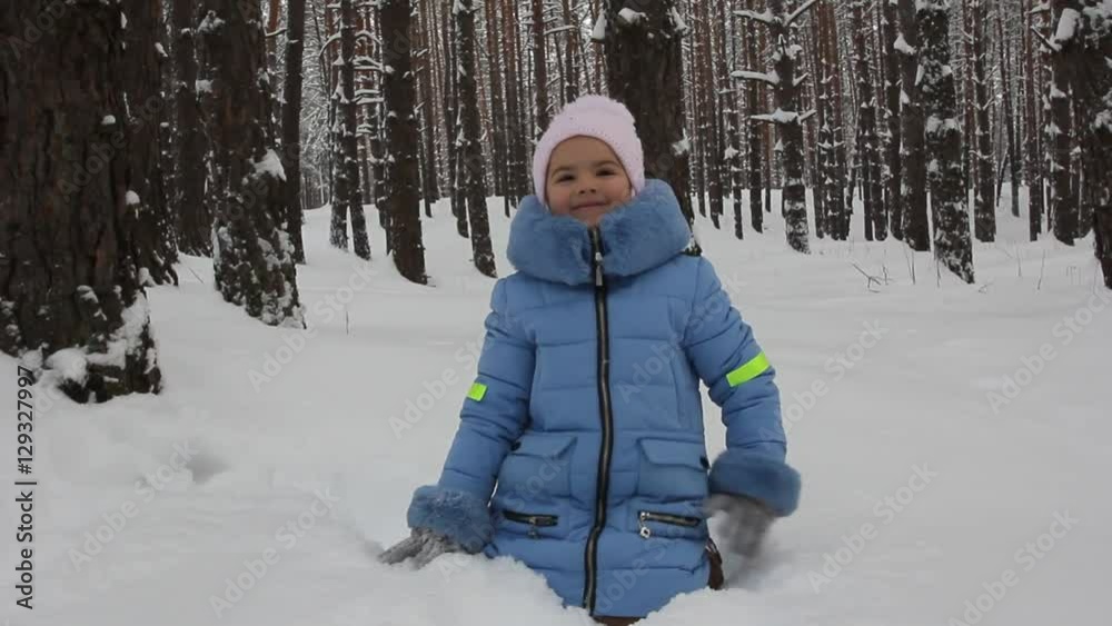little girl is playing in the snow little girl is playing in the snow