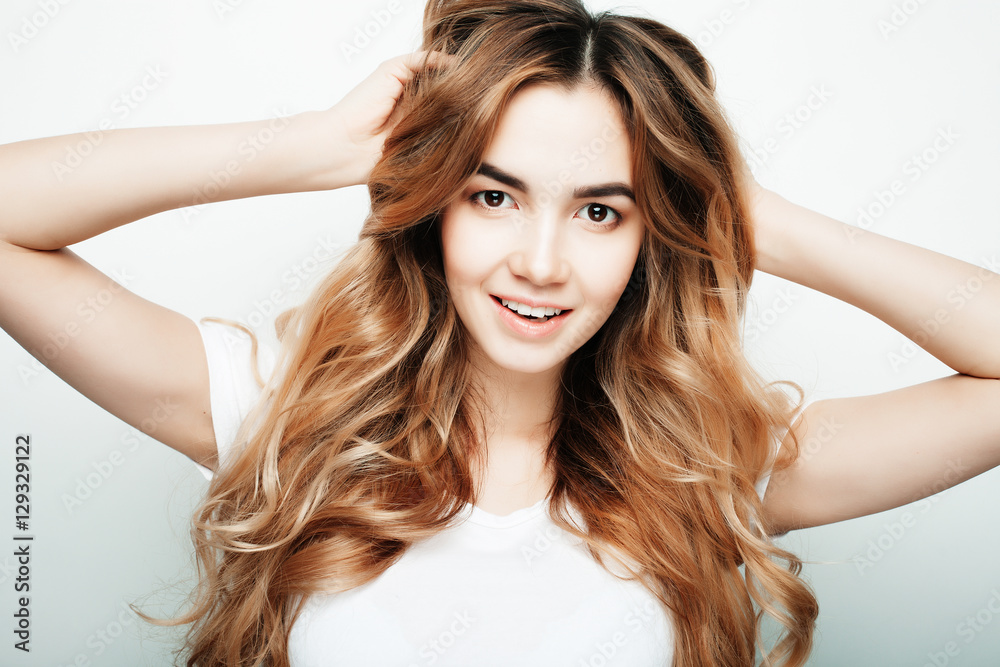 lifestyle and people concept: Young casual woman portrait. Clean face, curly hair. lifestyle and people concept: Young casual woman portrait. Clean face, curly hair.