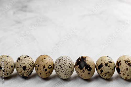 Food: group of quail eggs and egg, isolated on white background