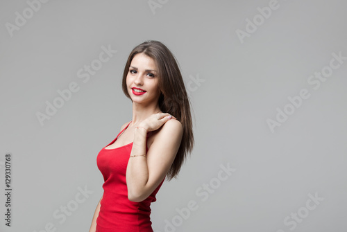 Portrait of beautiful brunette woman posing in studio