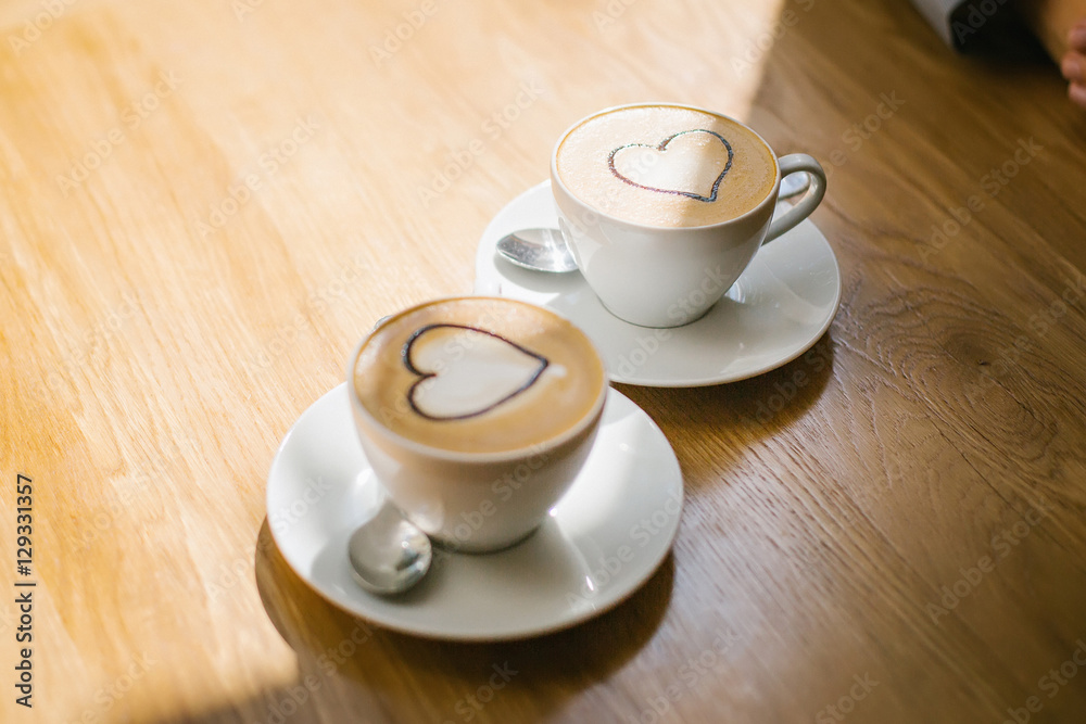 Obraz premium two cups of coffee with cream