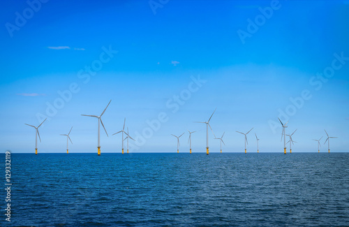 Offshore Wind Turbine in a Wind farm under construction off the coast of England.